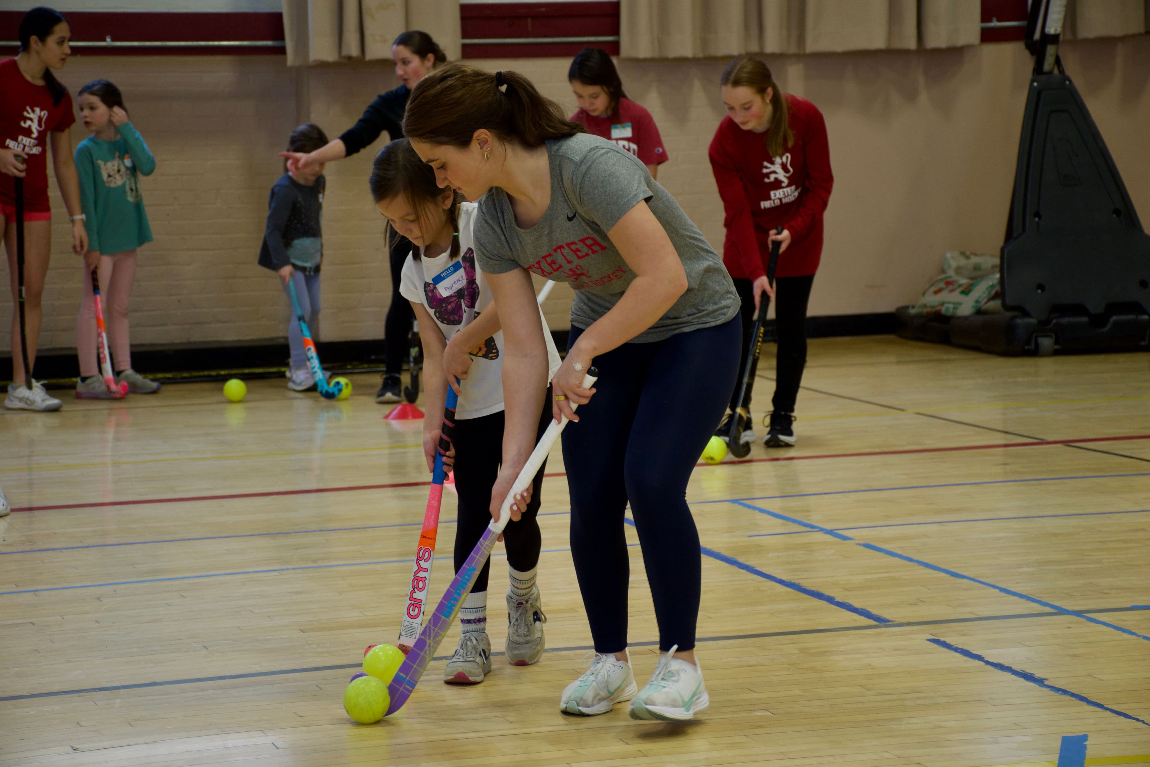 On Feb. 5, dozens of young girls from the community came to campus to participate in Exeter's first National Girls and Women in Sports Day. Smiles and laughter filled the athletic complex as young girls practiced and competed in everything from field hockey to volleyball and everything in between. Exeter athletes demonstrated what it really means to put Non Sibi into action, as they volunteered to lead this event. It created a space where younger girls had role models to look up to and show them what it means to be a girl in sports.